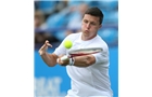 EASTBOURNE, ENGLAND - JUNE 14: Ken Skupski of Great Britain plays a forehand against Remi Boutillier of France during their Men's Singles qualifying match on day one of the Aegon International at Devonshire Park on June 14, 2014 in Eastbourne, England.  (Photo by Steve Bardens/Getty Images)